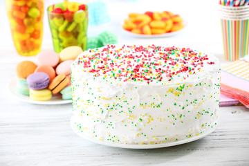 Birthday cake on colorful background