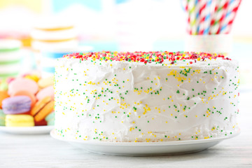 Birthday cake on colorful background
