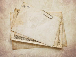 Vintage paper card on wooden texture
