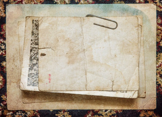 Vintage paper card on old cloth background