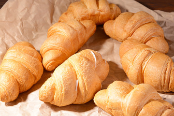 Delicious croissants on table close-up
