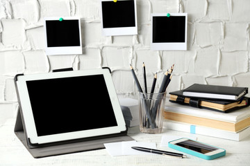 Stylish workplace with digital tablet at home or studio