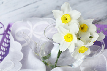 Fresh narcissus flowers on tray, closeup