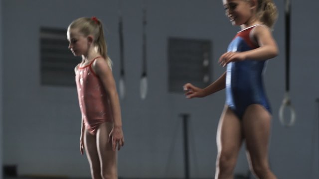 MS PAN Four girls (6-7, 8-9) exercising in gym, Orem, Utah, USA