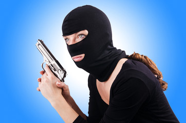 Criminal with gun isolated on white