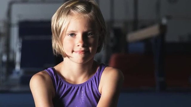 CU Portrait of girl (8-9) wearing leotard in gym, Orem, Utah, USA