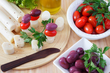 Canape of Heart of palm (palmito), cherry tomatoes, olives
