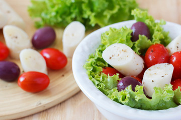 Fresh salad of heart of palm (palmito), cherry tomatoes, olives