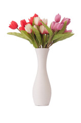 Vase with colourful tulips on white