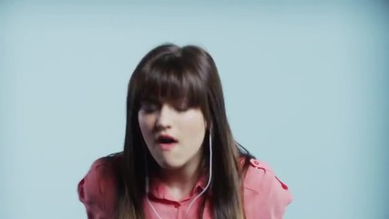 Close up of carefree woman with earbuds dancing / Cedar Hills, Utah, United States