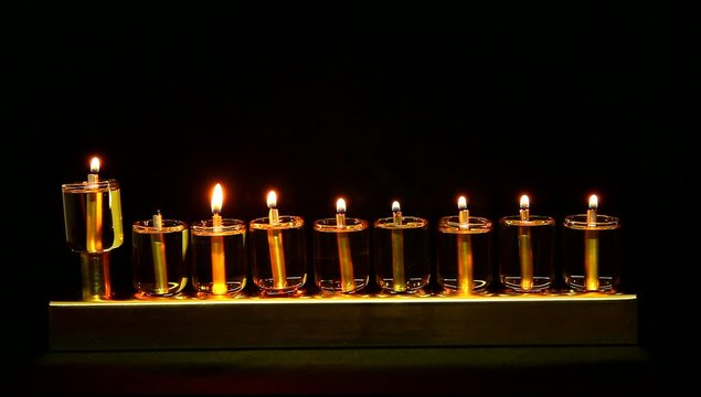 7 flames in Hanukia made of olive oil lanterns