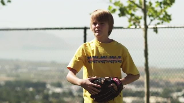 SLO MO MS Baseball player (12-13) catching ball, American Fork, Utah, USA