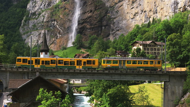 village at the base of a mountain waterfall
