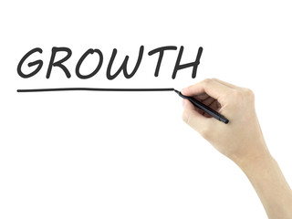 growth word written by man's hand