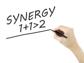 synergy word written by man's hand