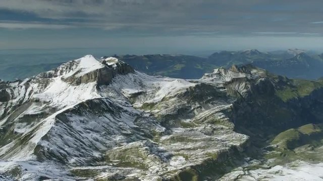 Wide shot/high angle of snow covered mountain / Schilthorn Piz Gloria, Bern, Switzerland