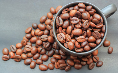Coffee beans and cup on paper background
