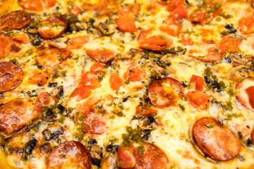 Appetizing background pepperoni pizza closeup filling the frame.