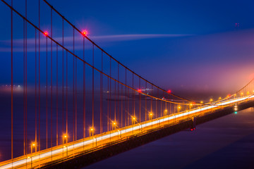 Night view of the Golden Gate Bridge and fog from Battery Spence