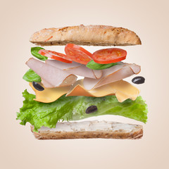 Sandwich with falling ingredients in the air
