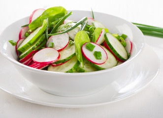 Fresh healthy salad  in  white bowl.