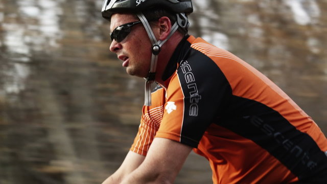MS TS Man cycling in countryside / Highland, Utah, USA