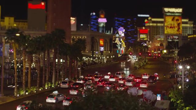 Wide time lapse of cars driving near casinos and hotels / Las Vegas, Nevada, United States