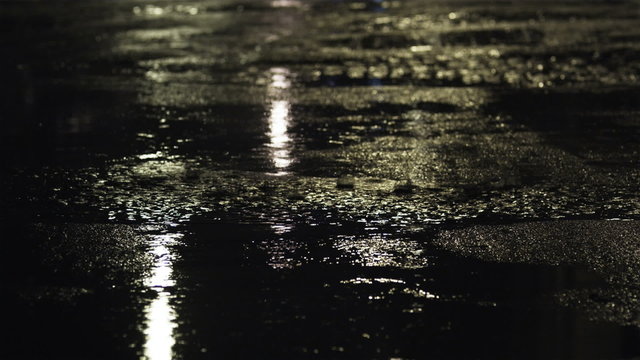 CU TU MS Puddles and traffic on street at night, New York City, New York, USA