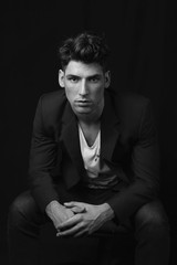 Man sitting in black and white