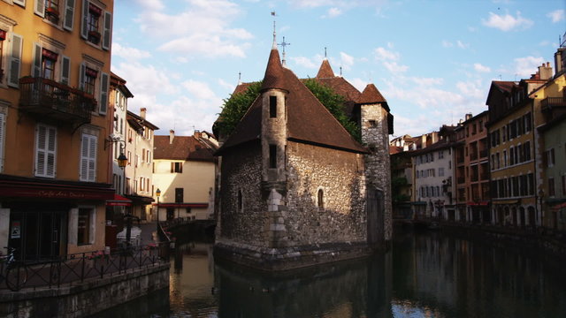 European cityscape of a river, a bridge and buildings