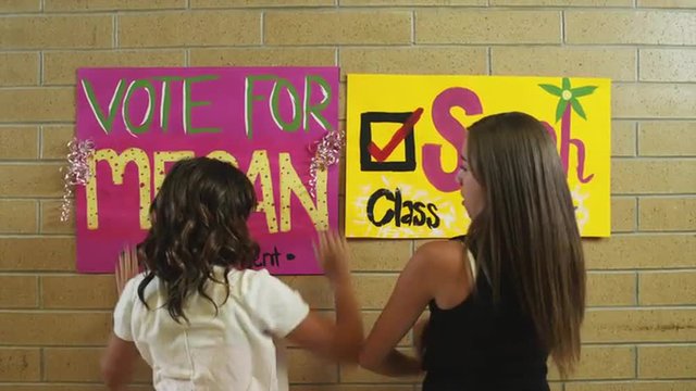 MS ZO Students attaching posters on wall / Spanish Fork City, Utah, USA