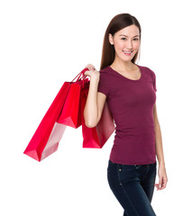 Asian woman with red shopping bag