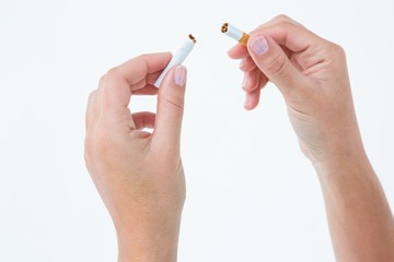 Close up of a woman breaking cigarette