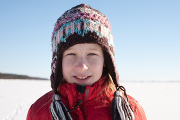 Fototapeta na wymiar young girl in knitted cap