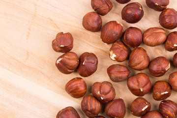 Wooden table with nuts.