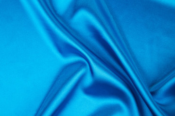 Blue silk texture close up.