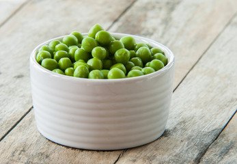 Fresh Green peas close up  on wooden background