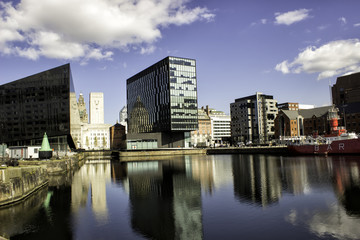 Fototapeta na wymiar Very nice view of modern buildings in Liverpool. Reflection in the riverCity of Liverpool
