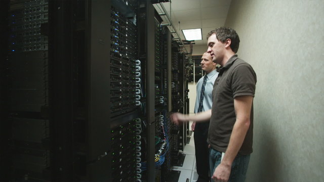 two men in a server room