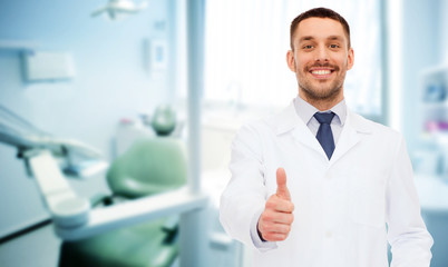 smiling male doctor showing thumbs up