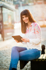 Obraz premium Mobilty - woman with tablet on street