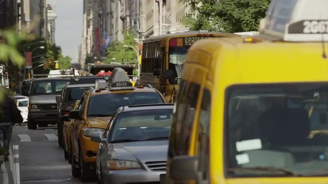 Medium shot of traffic on city street / New York City, New York, United States