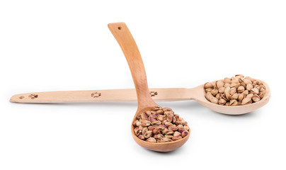 Wooden spoons with pistachios.