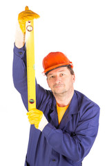 Worker in hardhat with measure ruler.