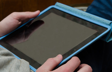Tablet in the Hands