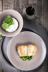 Fried cod fillets and spinach