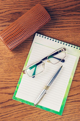 Notepad on the wooden table