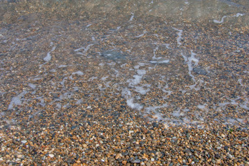 surf in stones on embankment