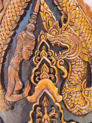 Traditionnal carving on wooden pole in temple