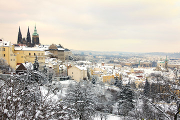 Obraz premium Snow in Prague City with gothic Castle, Czech Republic